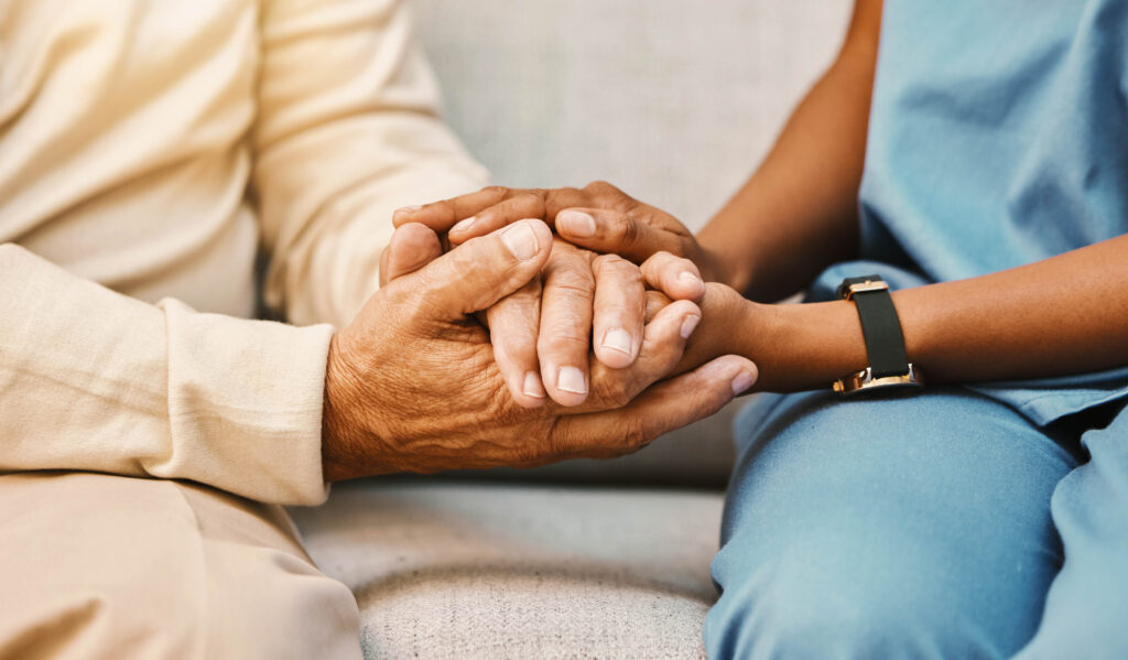 Nurse, hands and senior patient in empathy, safety and support of help, trust and healthcare consulting. Nursing home, counseling and gratitude for medical caregiver, client and hope in consultation.